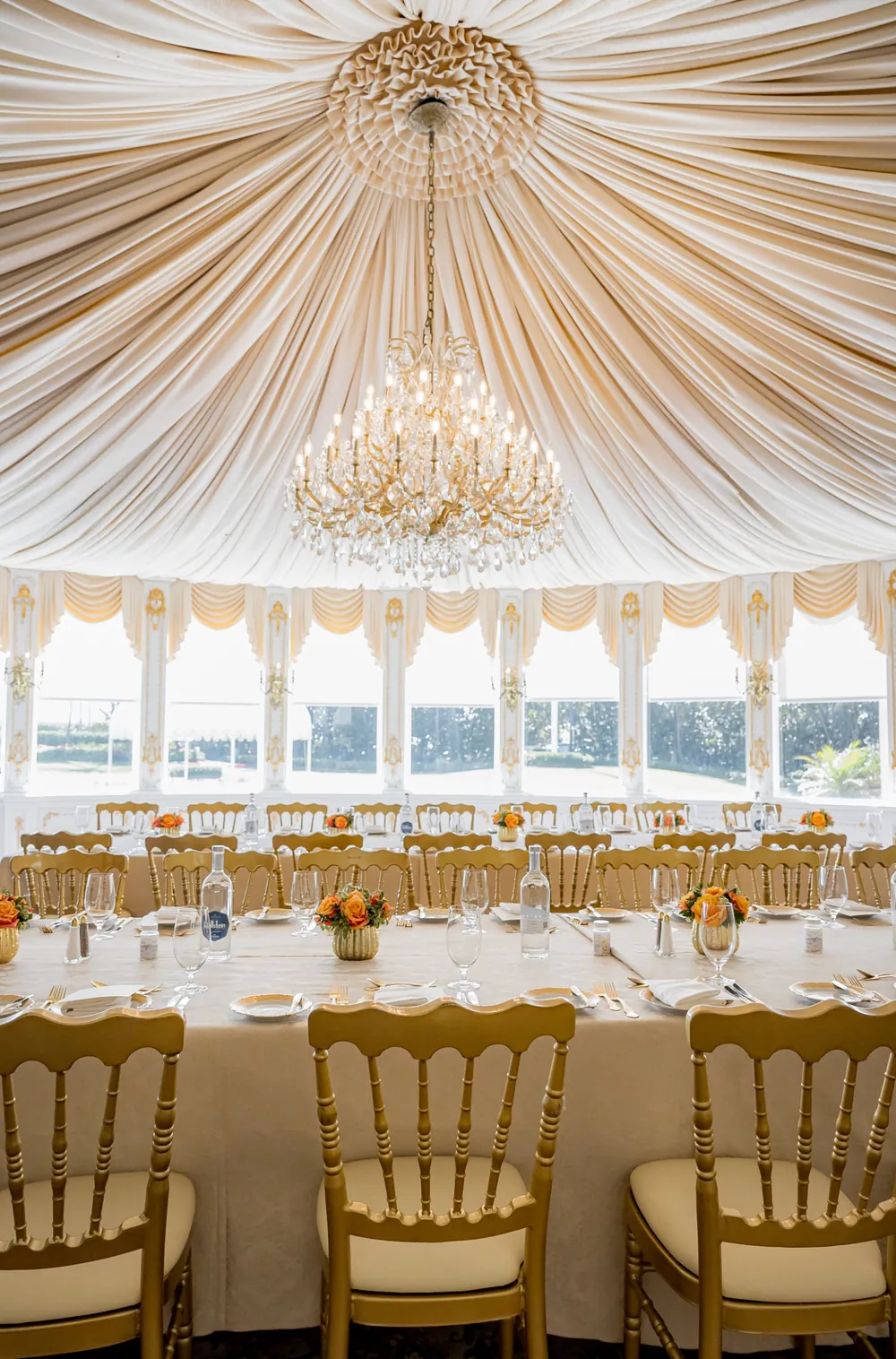 Dining room set beneath a crystal chandelier at Mar-a-Lago, Palm Beach